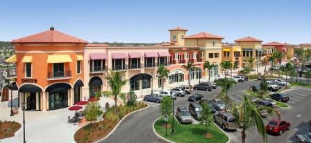 Picture showing the view across a plaza of shops at the Coconut Point Mall in Estero