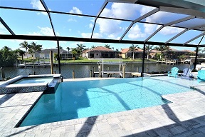 Picture of a pool deck and the pool of a newly constructed home