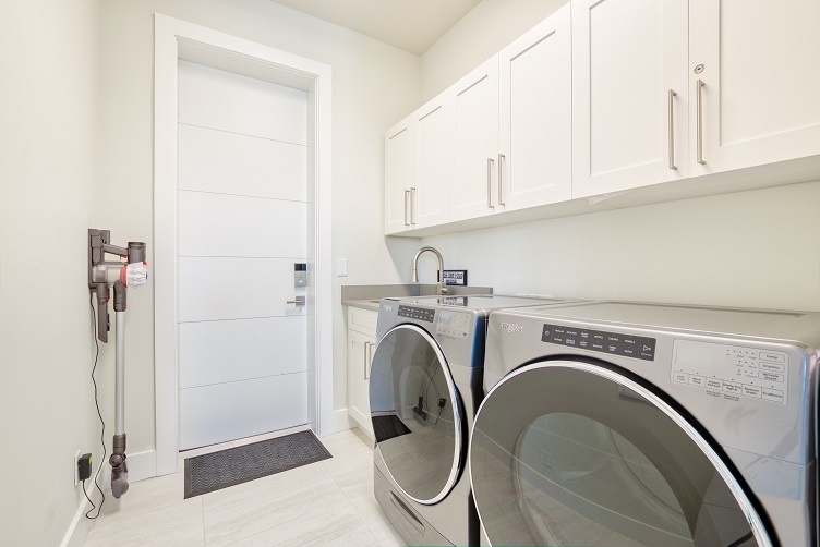 Picture of the New Construction Model Sunshine Paradise showing the laundry with washer and dryer
