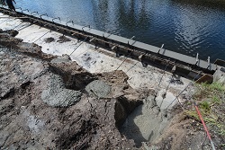 Picture showing the poured concrete seawall cap with the tiebacks installed