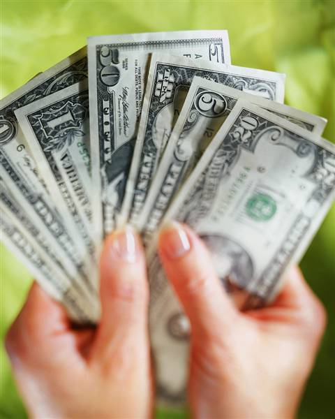 Picture of hands showing dollar bills